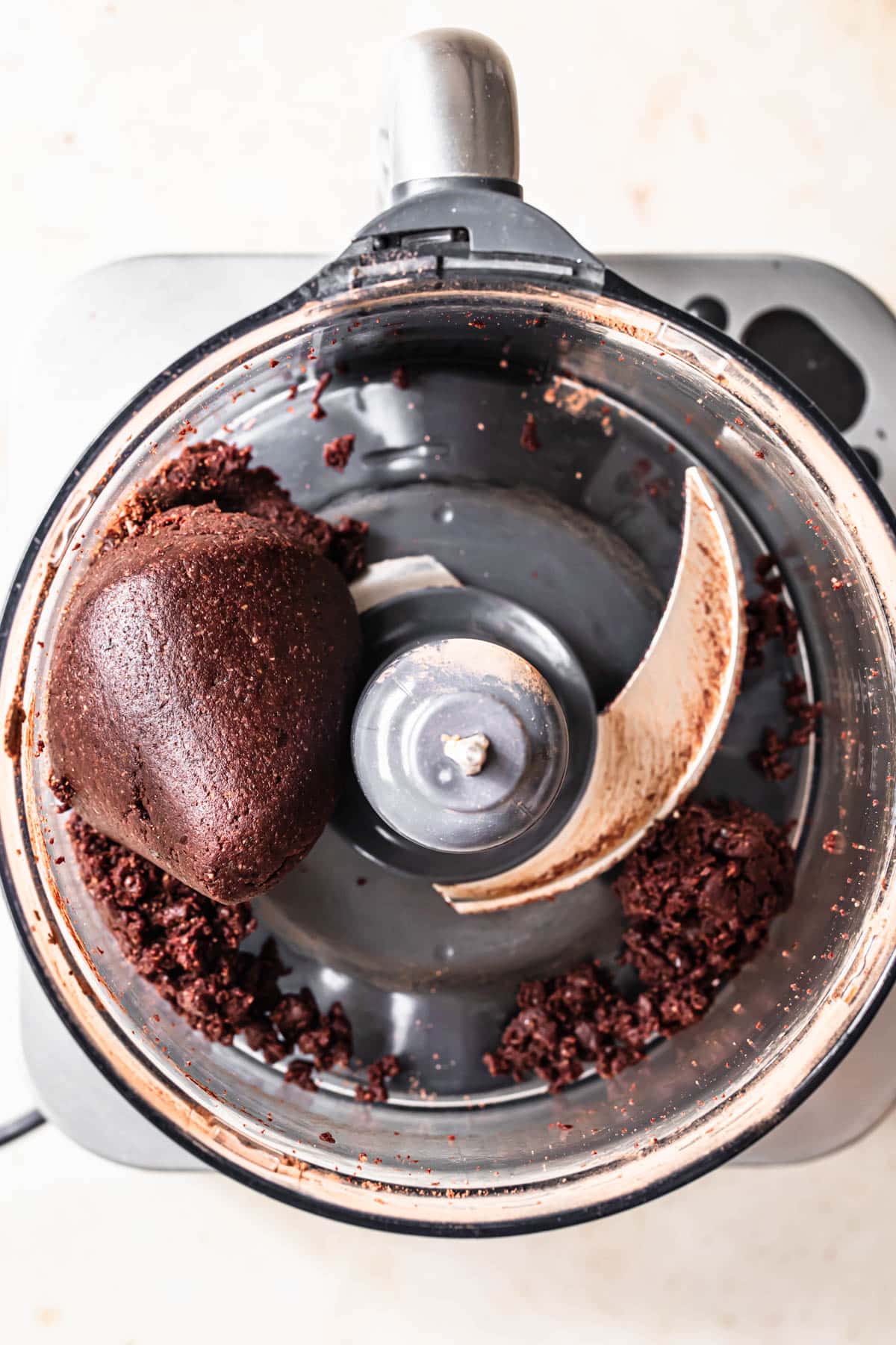 Gluten free rum ball mixture blended together in a food processor.
