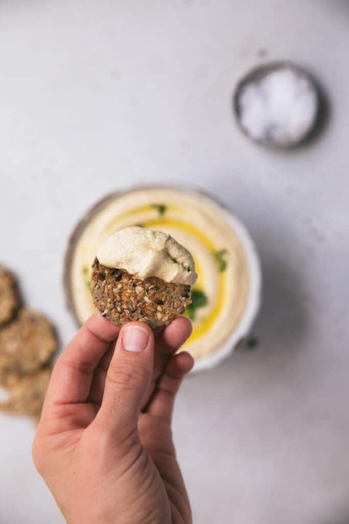 serve hummus with seeded crackers as a healthy snack