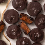 Close up of dark chocolate almond butter cups.