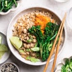 asian chicken rice bowl with kimchi, broccolini and beans
