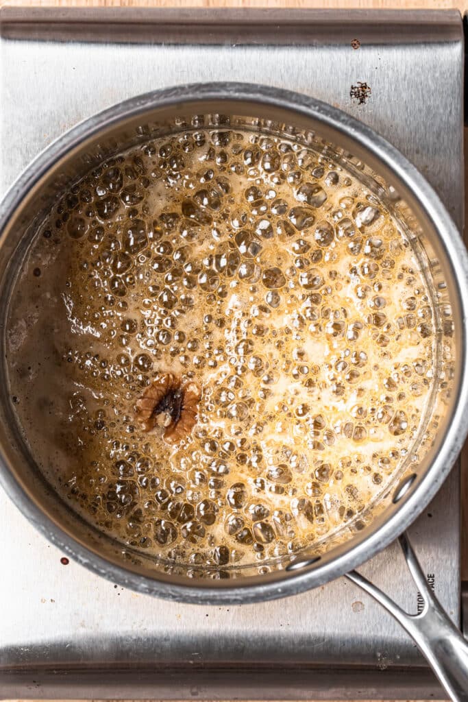 Honey bubbling in a saucepan.