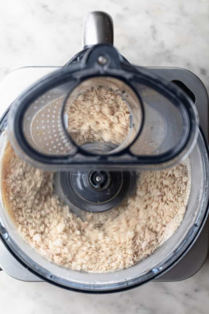 ingredients being pulsed together in food processor.