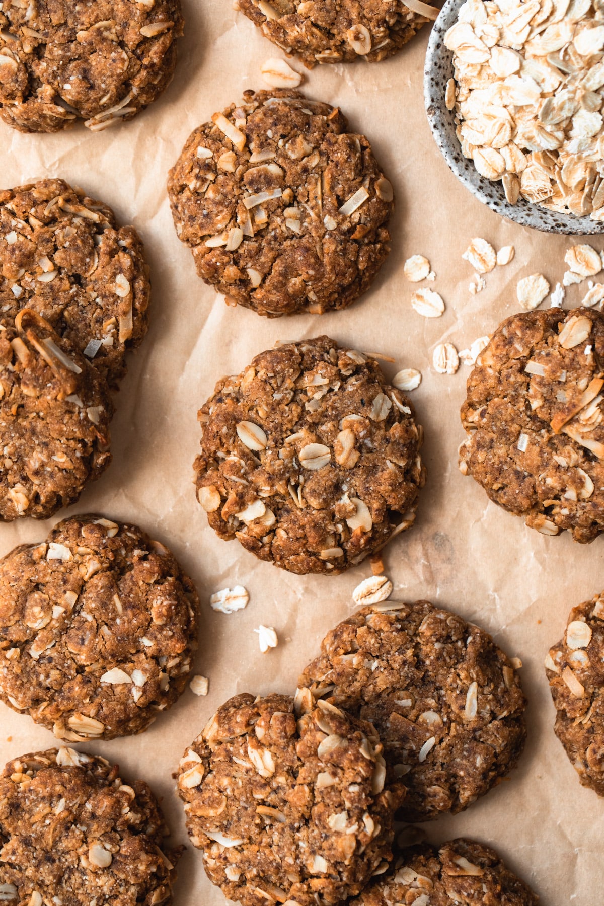 baked healthy Anzac biscuits on baking paper.