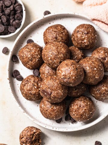 Peanut Butter Chocolate Bliss Balls on a white plate.