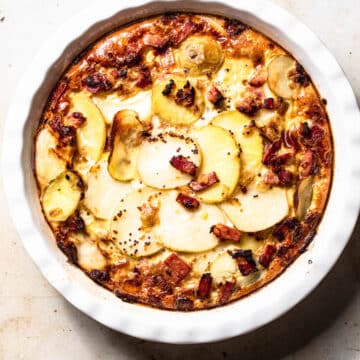 Dairy free frittata with potato and bacon in a quiche dish.