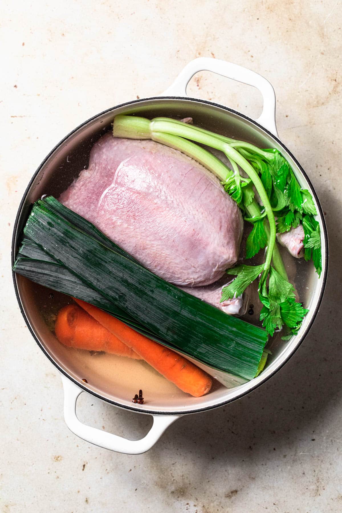Ingredients for chicken broth in large stock pot.