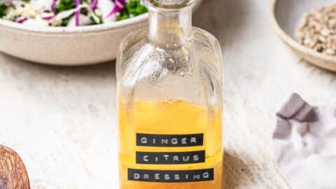 Ginger citrus dressing in a glass jar, labelled "Ginger Citrus Dressing".
