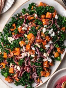 Roasted butternut squash salad on a serving platter.
