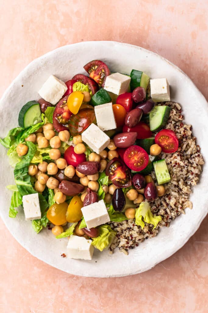 Olives, chickpeas and feta added to mediterranean grain bowls.