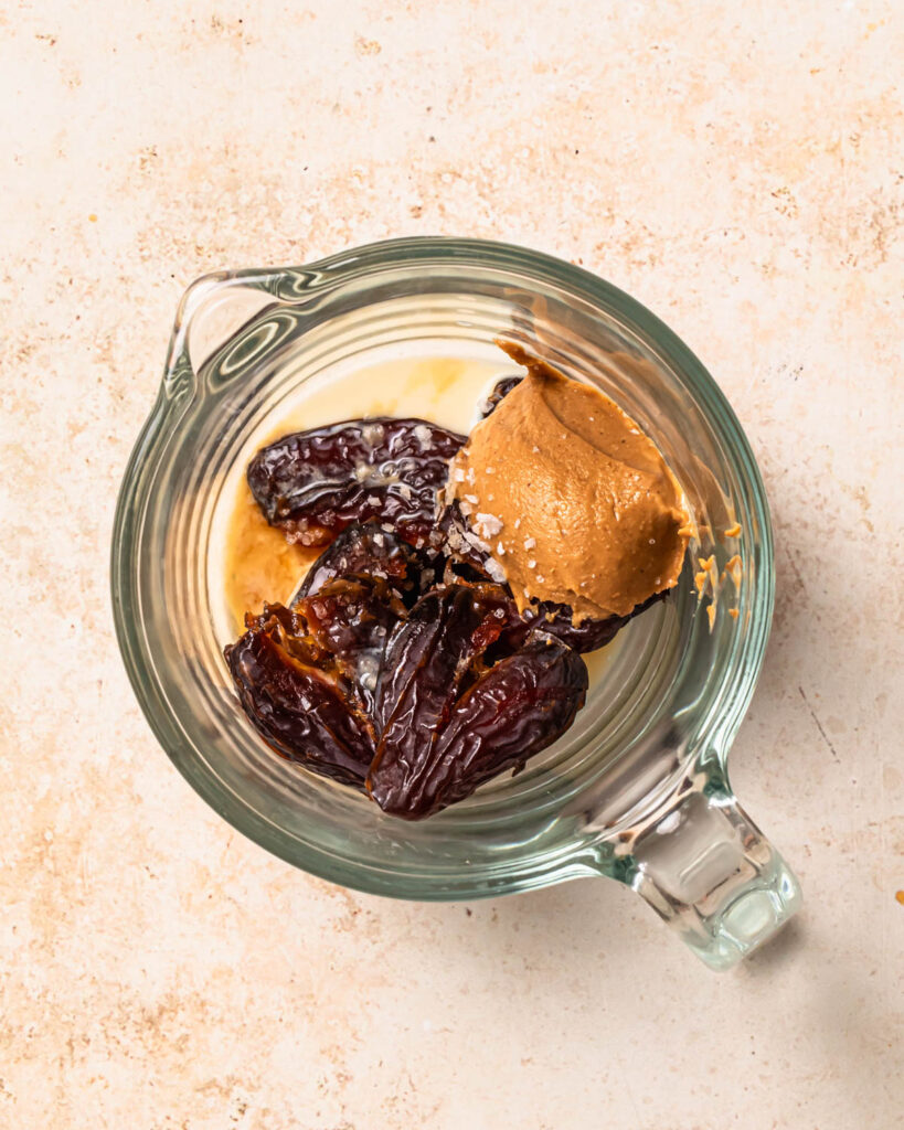 Ingredients to make salted date caramel in a jug.