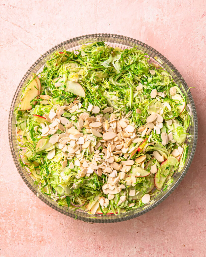 Flaked almonds added to a shaved brussels sprout salad. 