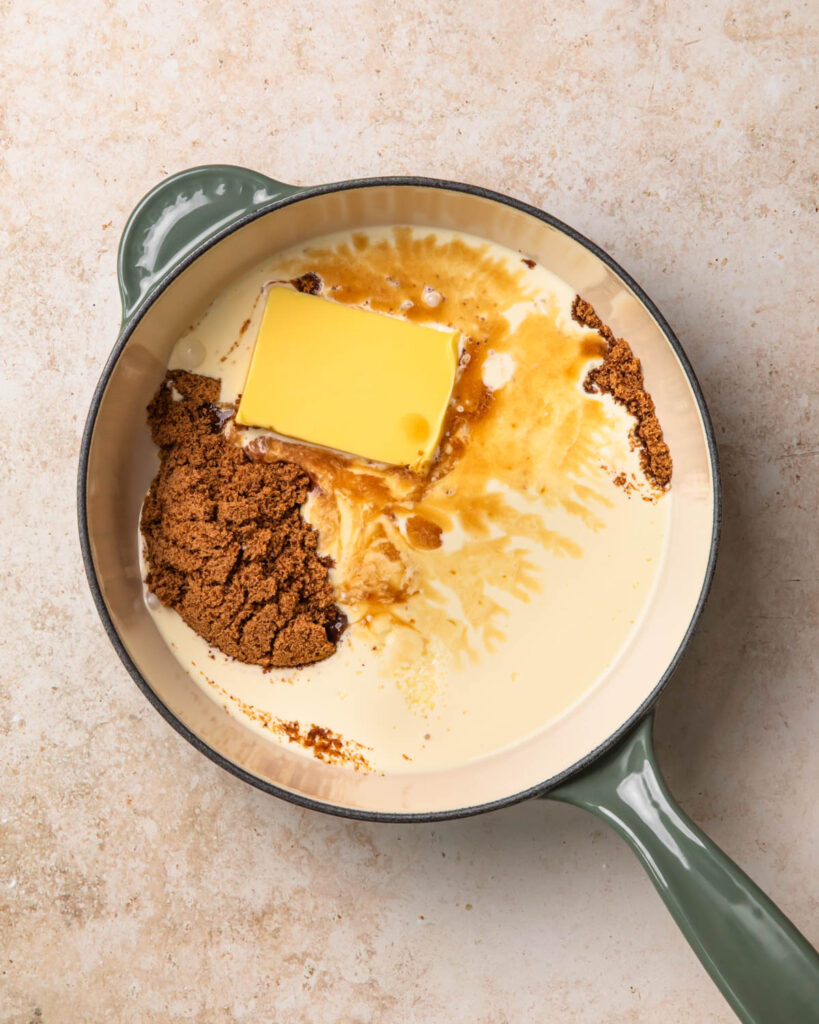 Ingredients for butterscotch sauce added to a pan.