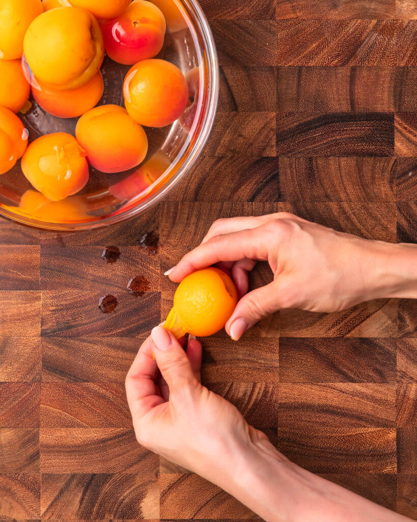 An apricot being peeled. 
