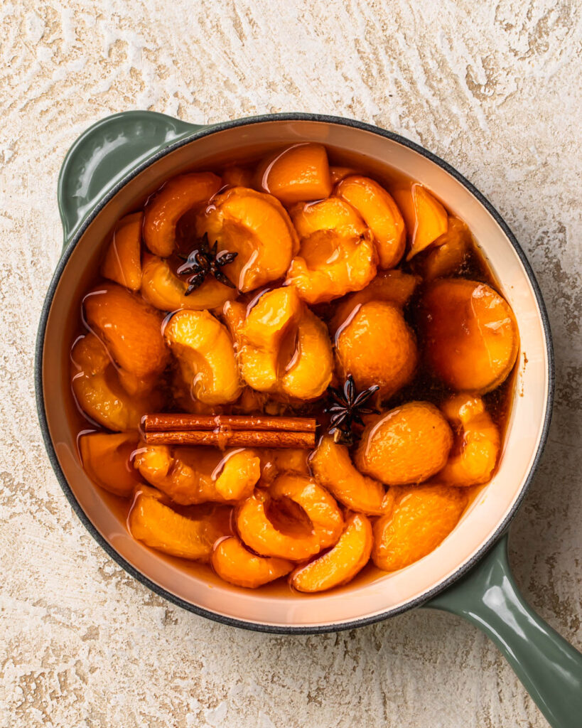 Ingredients for apricot glaze in a saucepan.