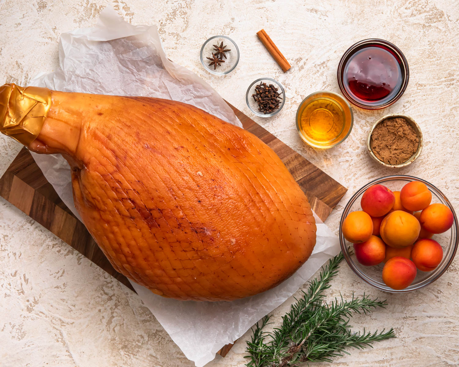 Ingredients for apricot glazed ham laid out in individual bowls. 