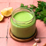 Creamy herb dressing in a jar.