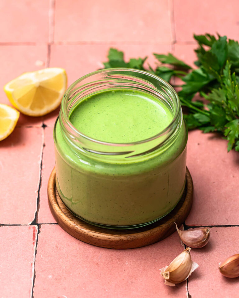 Creamy herb dressing in a jar.