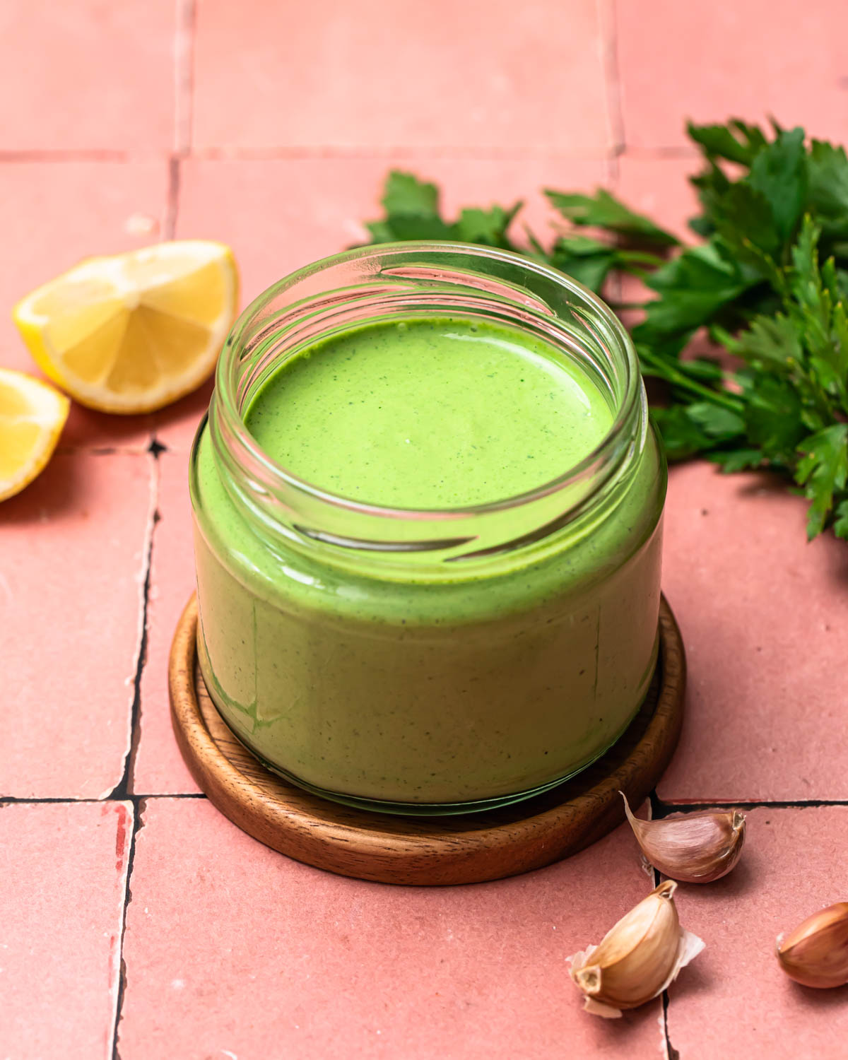 Creamy herb dressing in a jar.