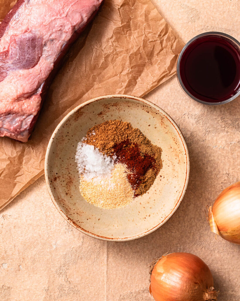 Spices added to a small bowl.