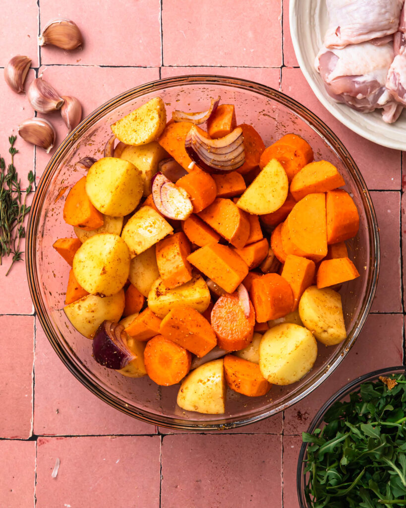 Seasoned vegetable pieces in a large mixing bowl. 