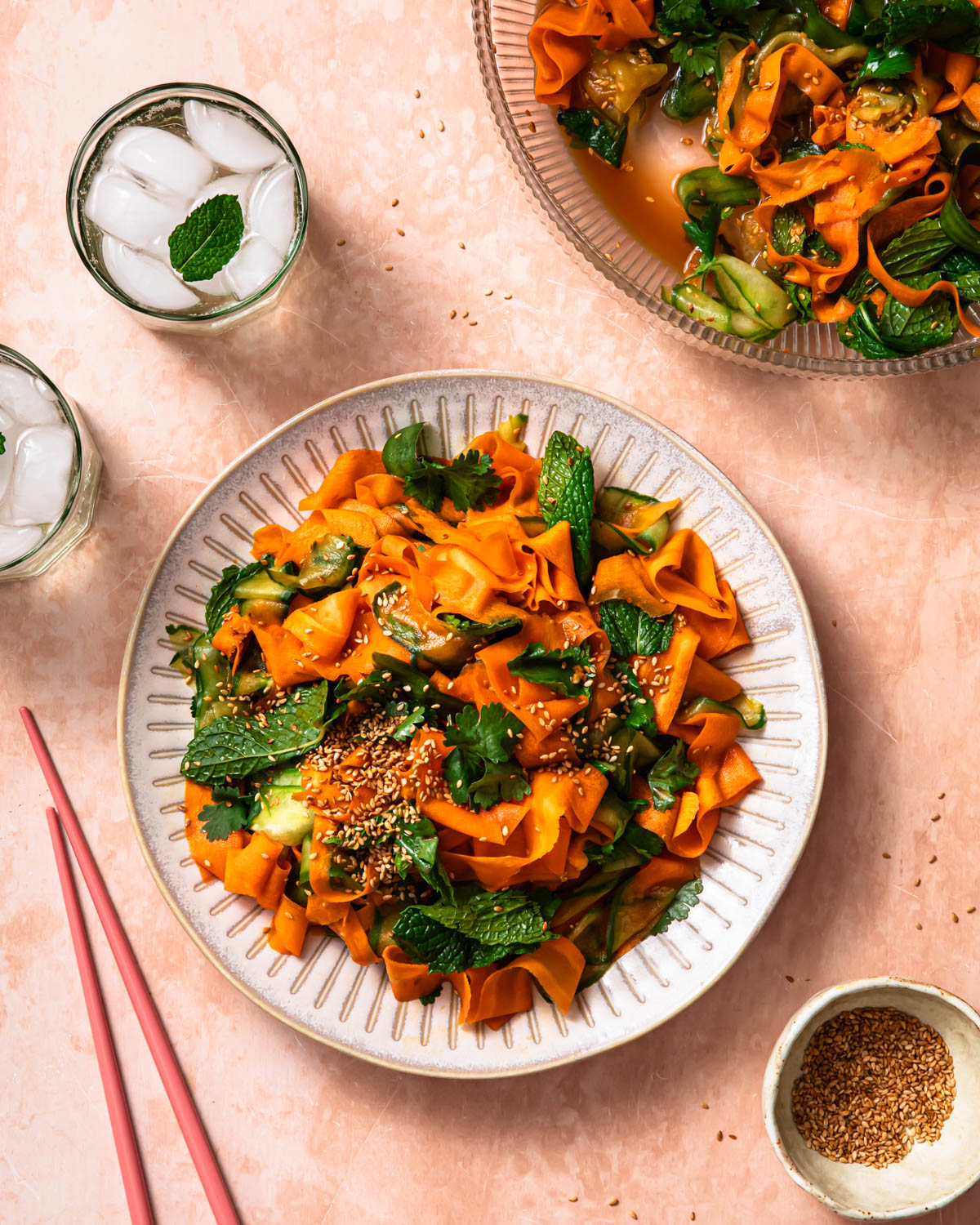 Asian carrot and cucumber salad piled on a plate.