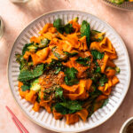 Asian carrot and cucumber salad piled on a plate.