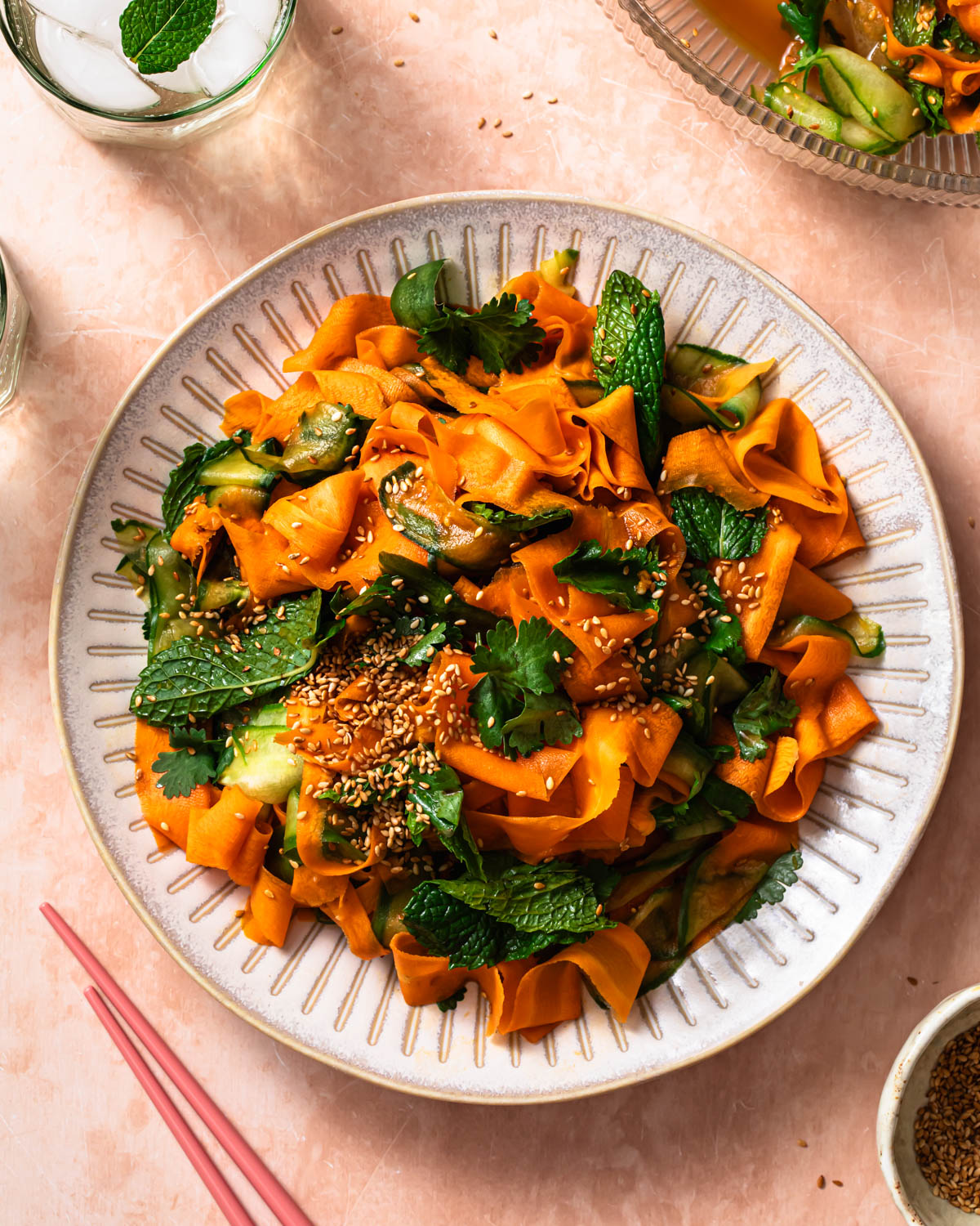 Asian carrot and cucumber salad piled on a plate.