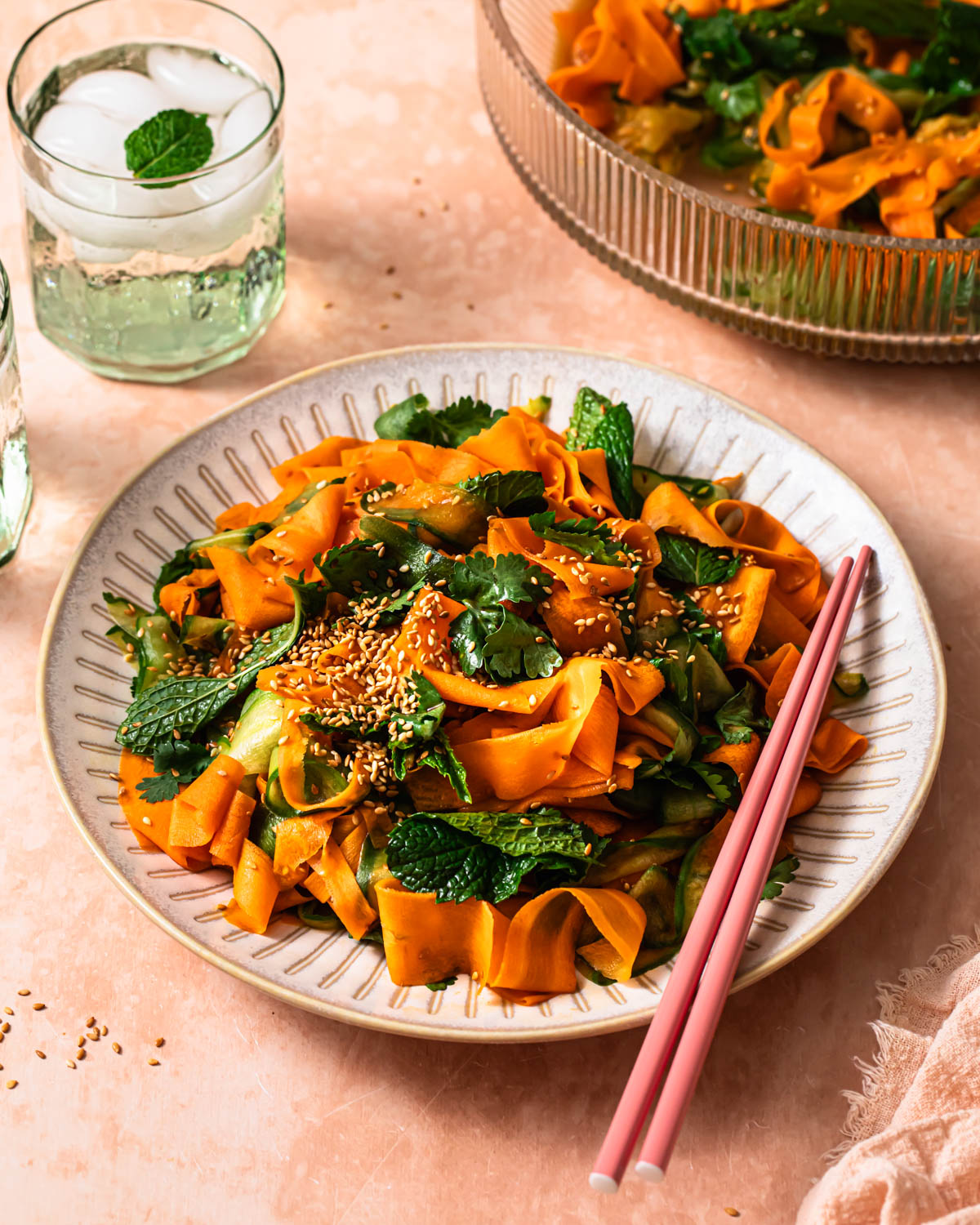 Asian carrot and cucumber salad piled on a plate.