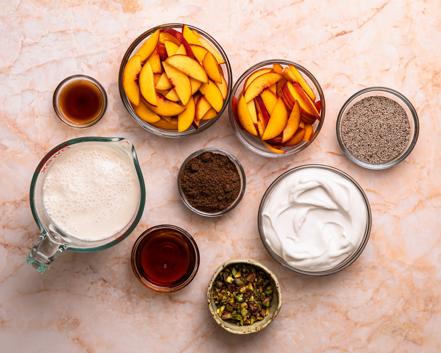 Ingredients for chia and flaxseed pudding laid out in seperate bowls. 