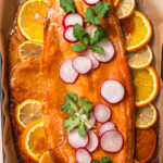 Citrus miso butter salmon baked on a baking tray.