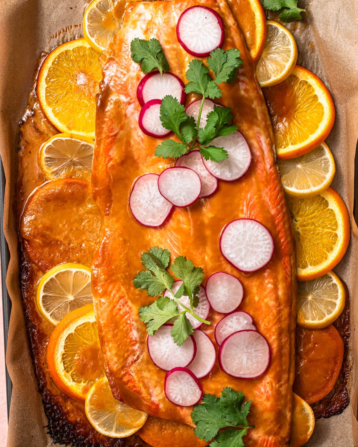 Citrus miso butter salmon baked on a baking tray.