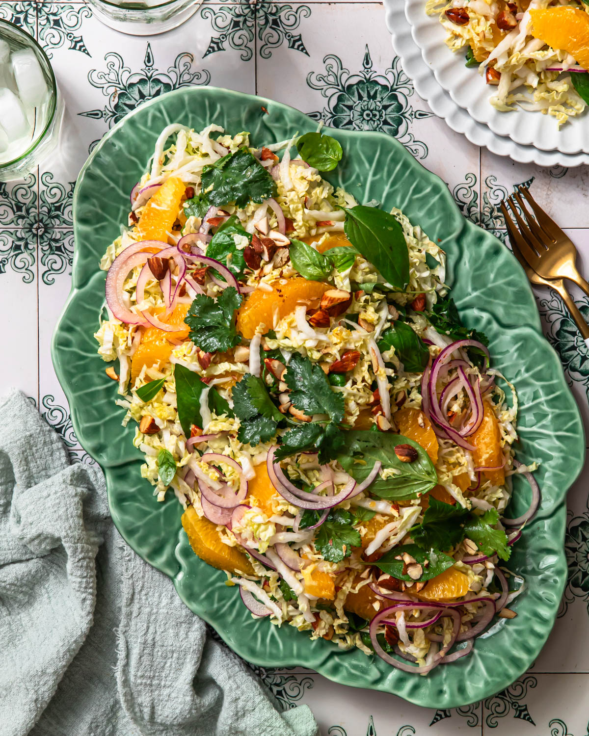 Citrus slaw arranged on a green platter.
