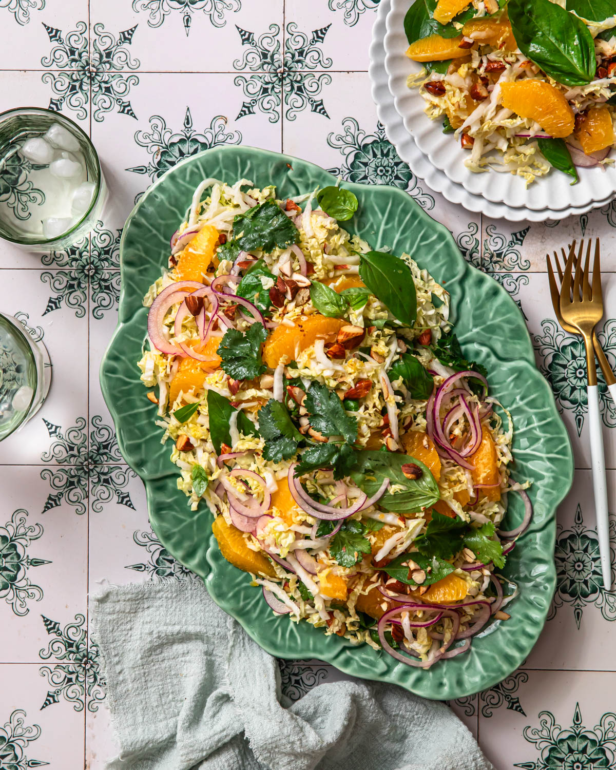 Citrus slaw arranged on a green platter.