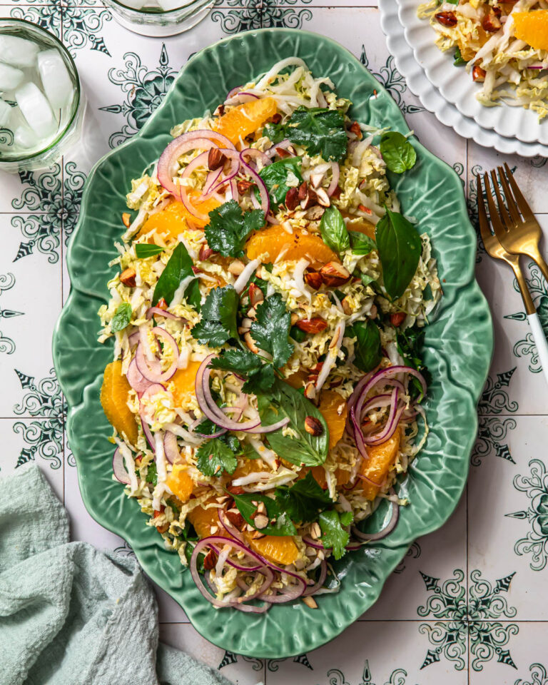 Citrus slaw arranged on a green platter.