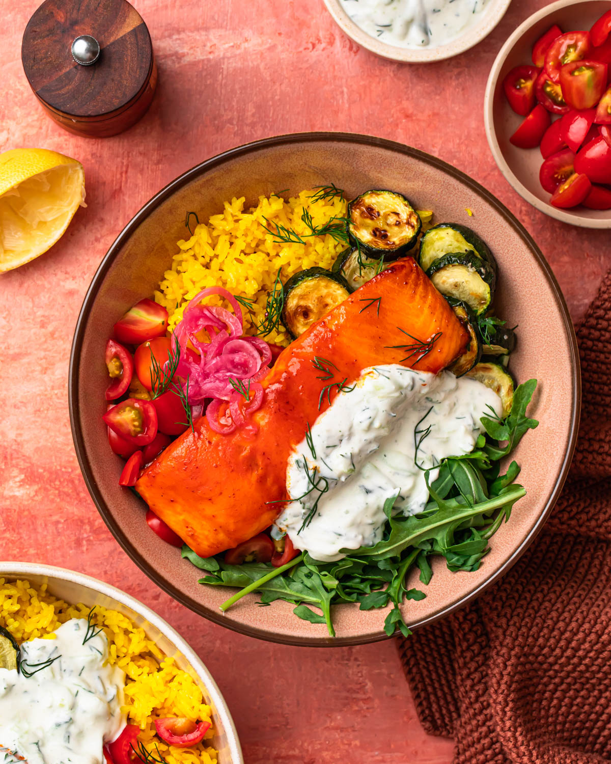 An image of an harissa honey salmon and rice bowl.