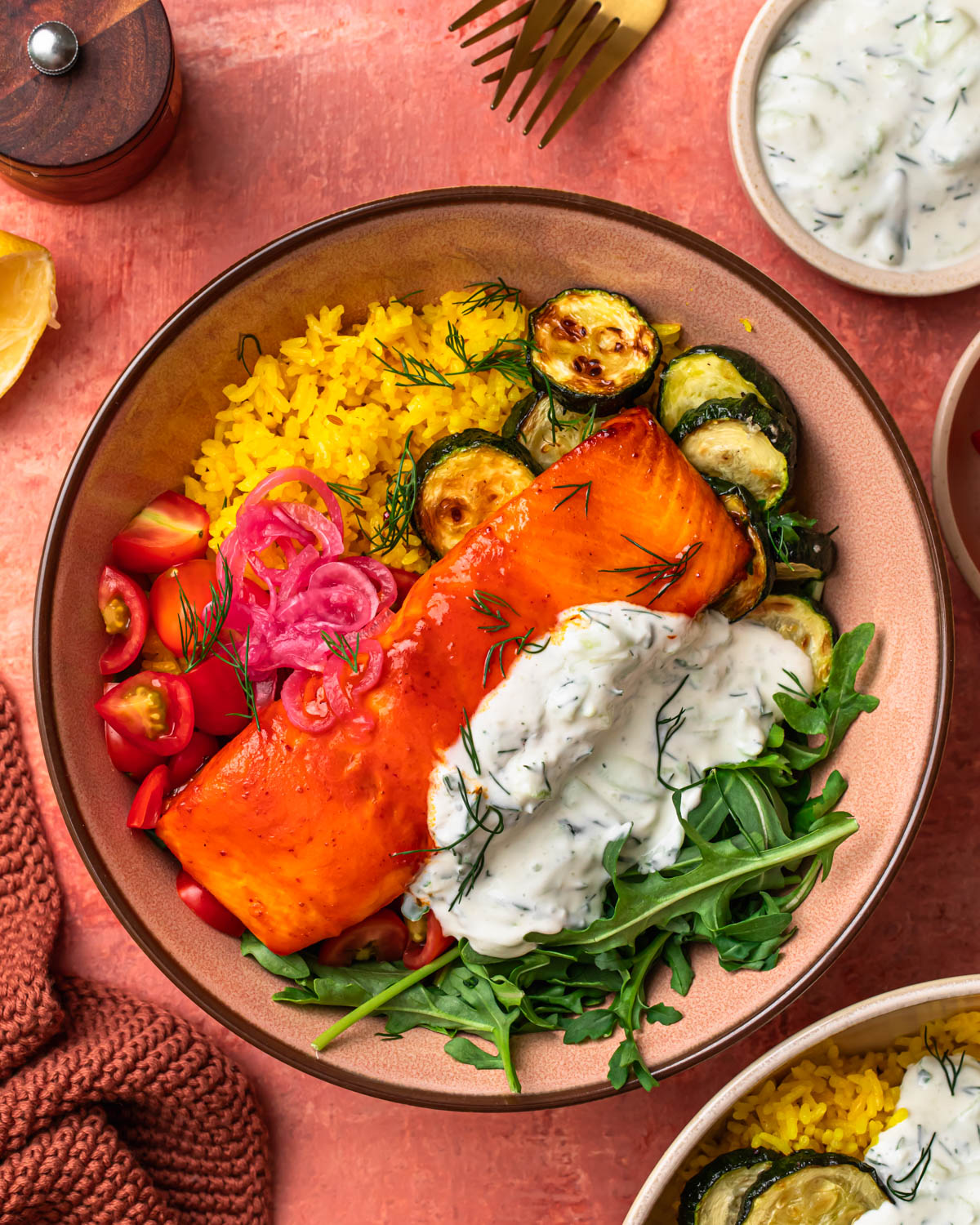 An image of an harissa honey salmon and rice bowl.