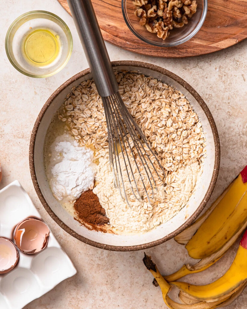 Dry ingredients added to banana bread baked oats mixture. 