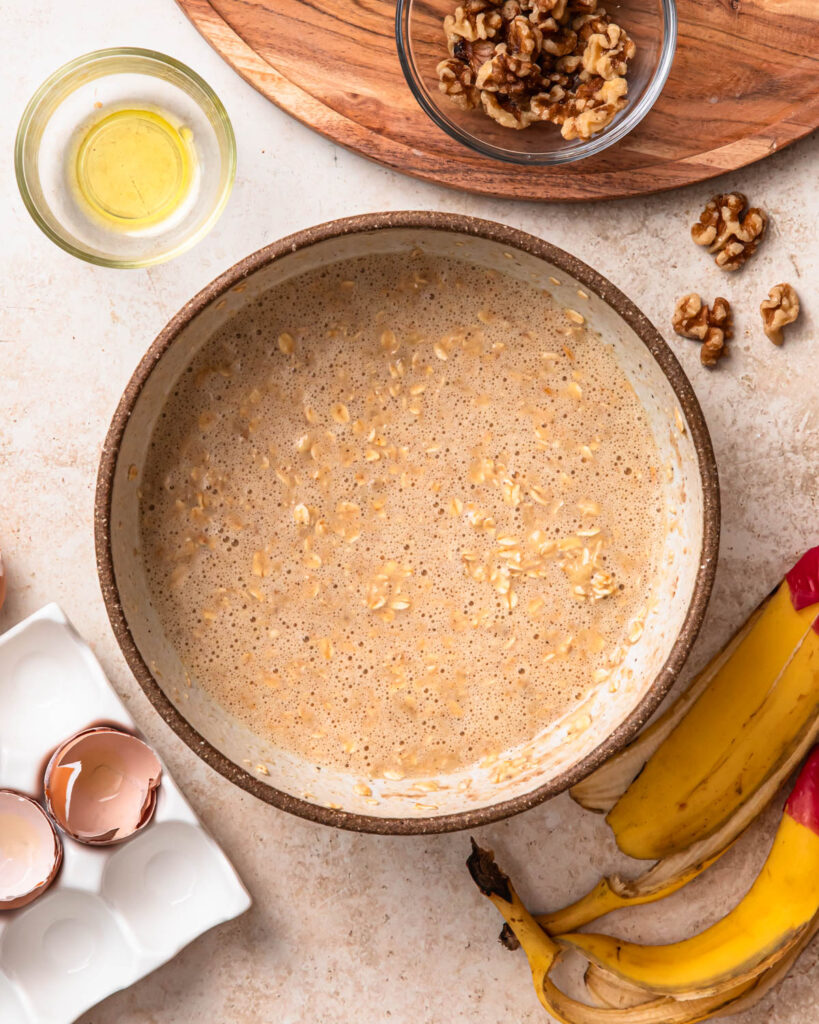 Banana bread baked oats mixture in a mixing bowl. 