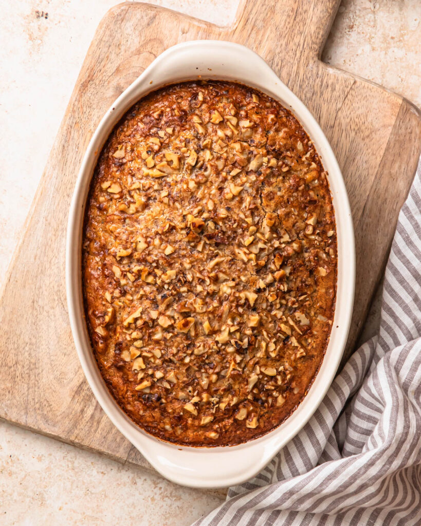 Banana bread baked oats, baked in an oval baking dish.