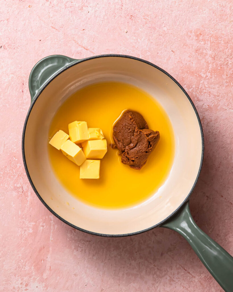 Ingredients for citrus miso butter sauce in a saucepan.