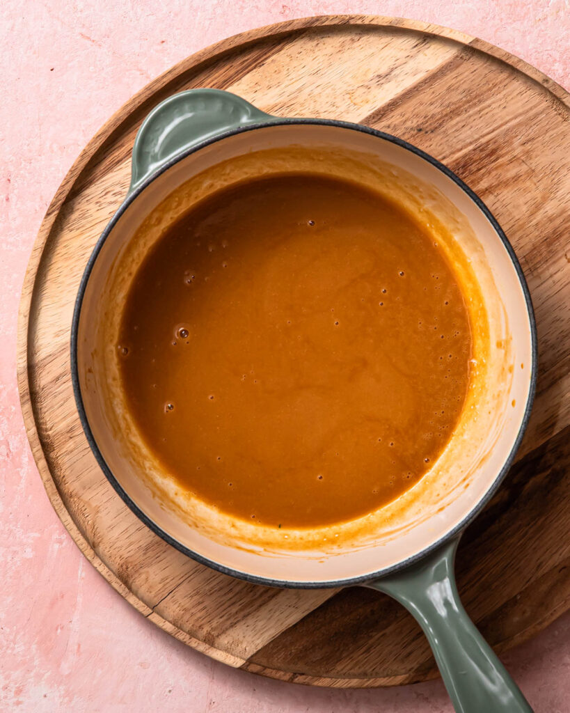 The miso butter sauce in a saucepan, ready to pour onto the salmon.