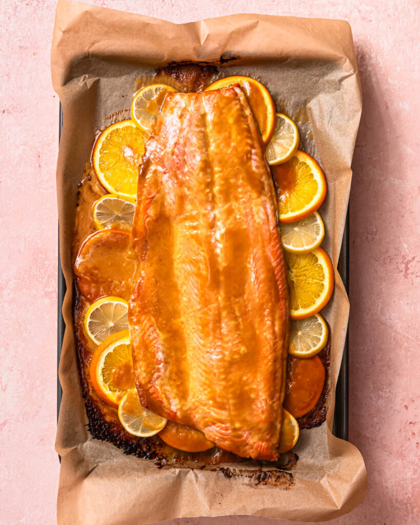 Baked citrus miso butter salmon on a baking tray.