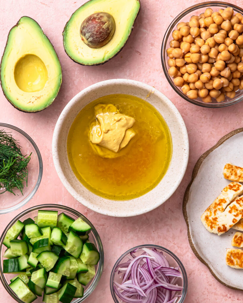 Ingredients for honey mustard dressing in a bowl.