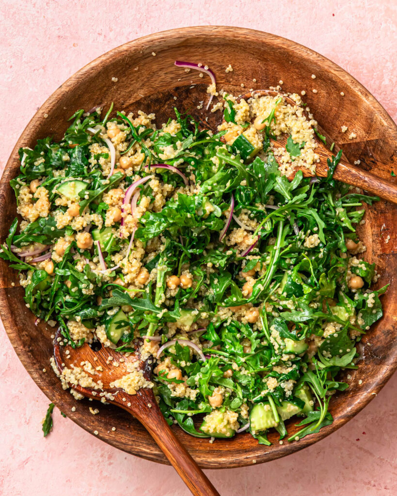Halloumi avocado salad tossed in a salad bowl. 