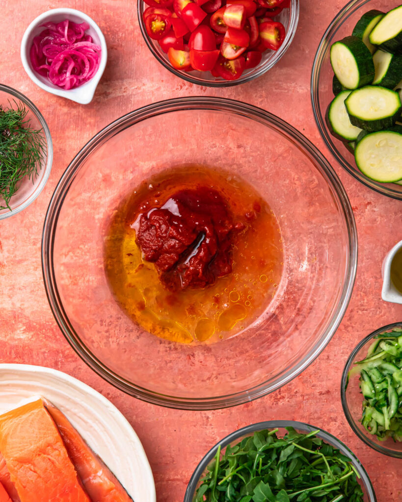 Ingredients for harissa honey salmon marinade in a bowl. 