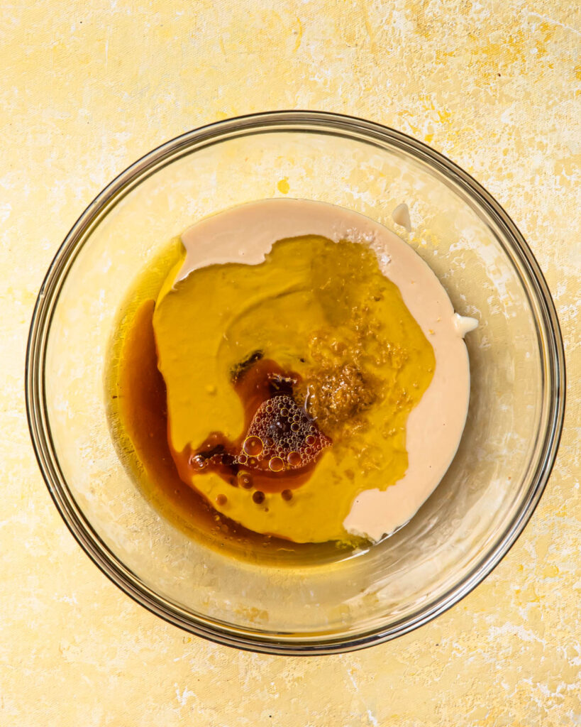 Wet ingredients added to a bowl. 