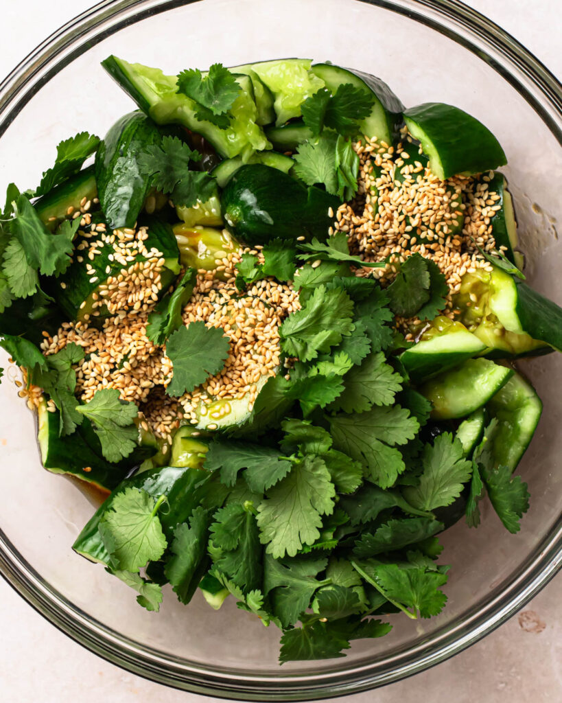 All ingredients for sesame cucumber salad added to a bowl.