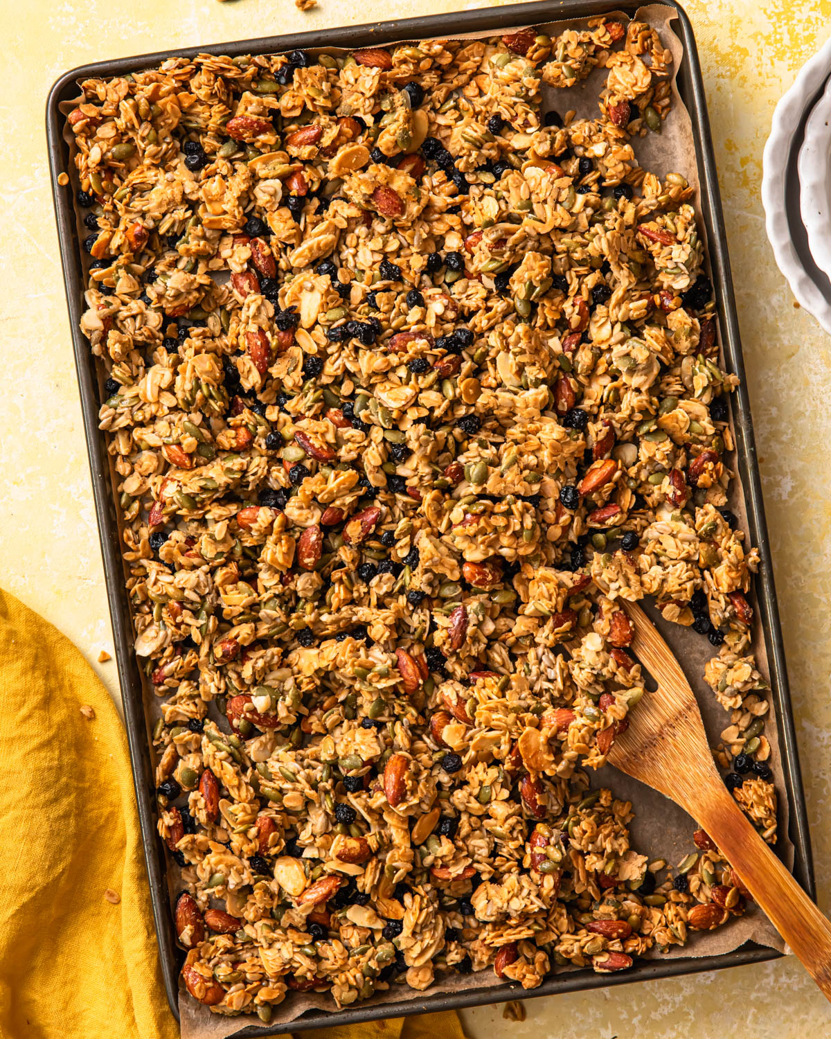 Baked lemon blueberry granola on a large baking tray.