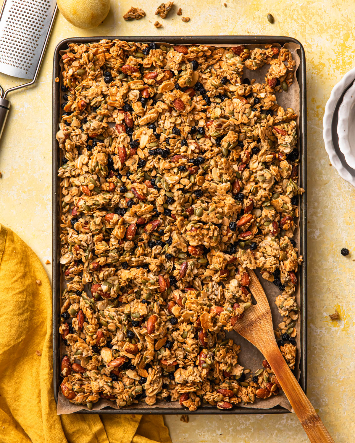 Baked lemon blueberry granola on a large baking tray.