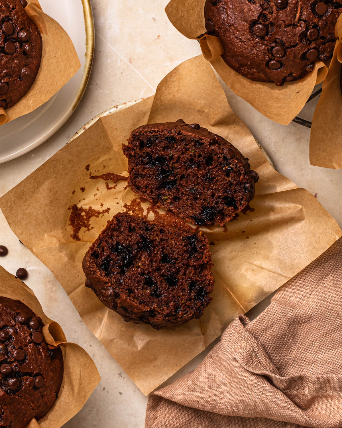 Gluten Free Chocolate Zucchini Muffin sitting on a plate.